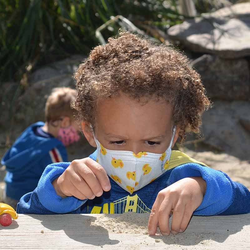 Image of a preschool student playing. Click on the image to view the jcc east bay donation form and donate today to help keep our programs running!